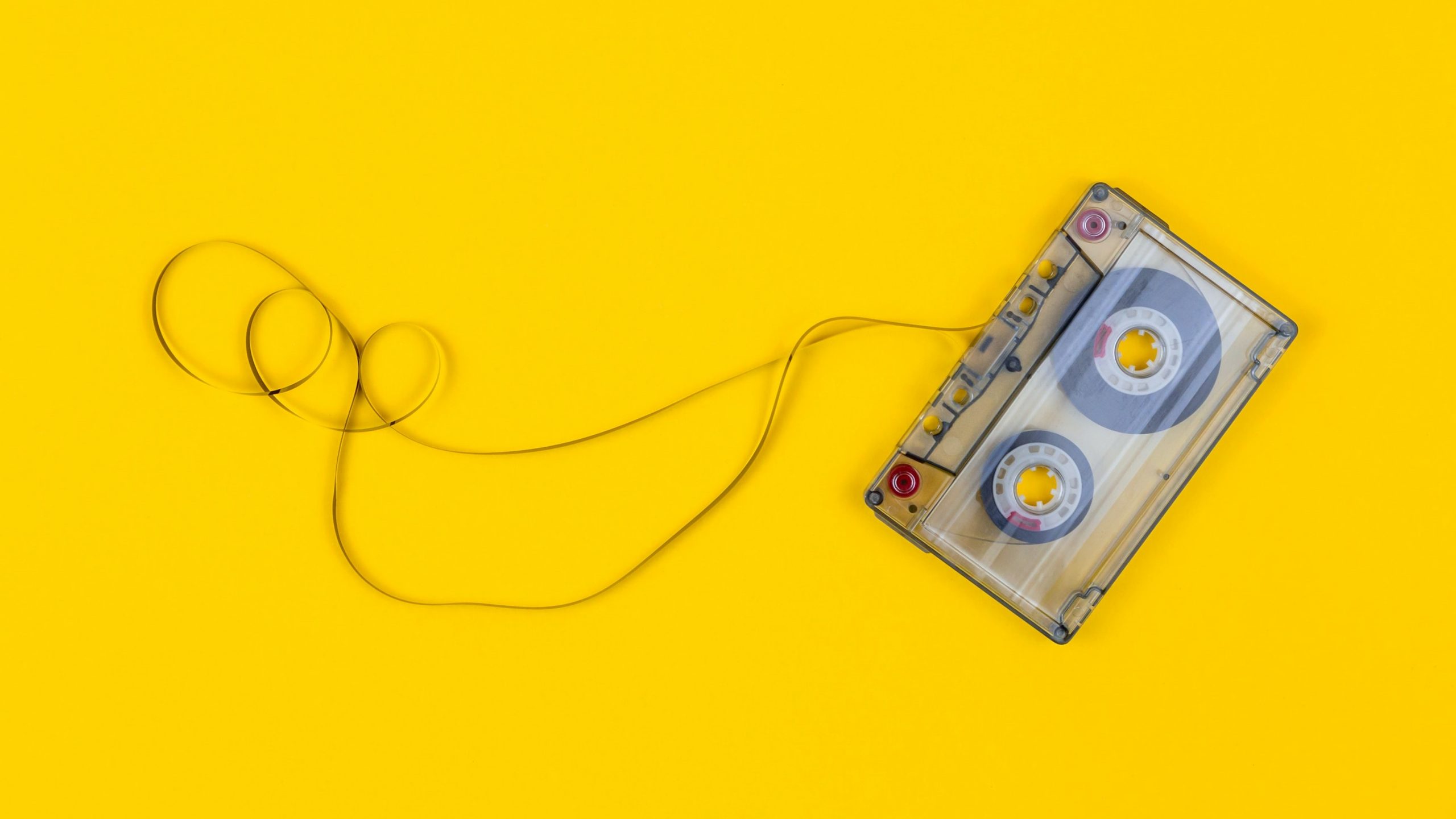 Music cassette on a yellow background.